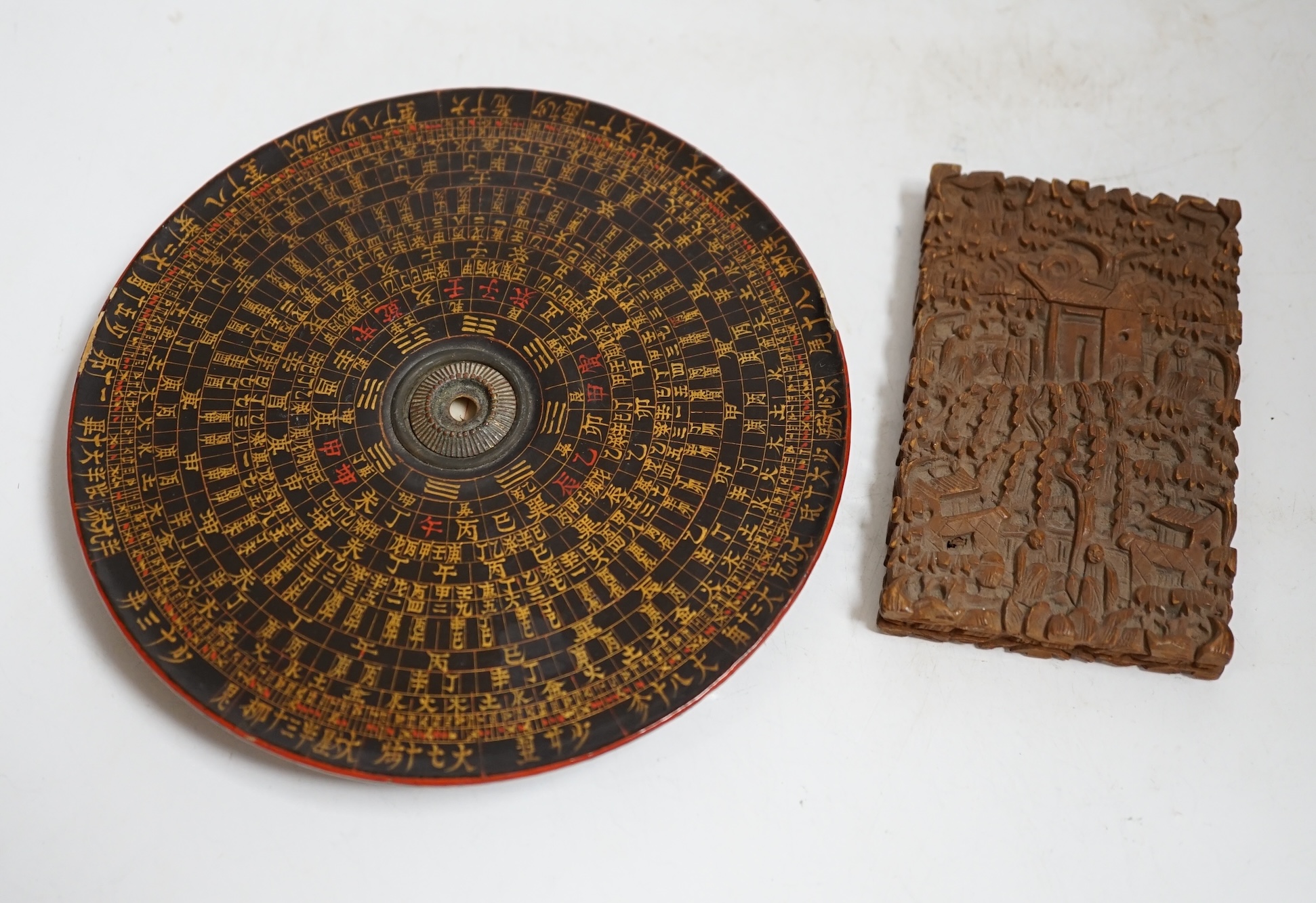 A Chinese sandalwood card case, carved with figures and Chinese Feng Shui lacquered compass, largest 14cm in diameter. Condition - fair, compass lacking